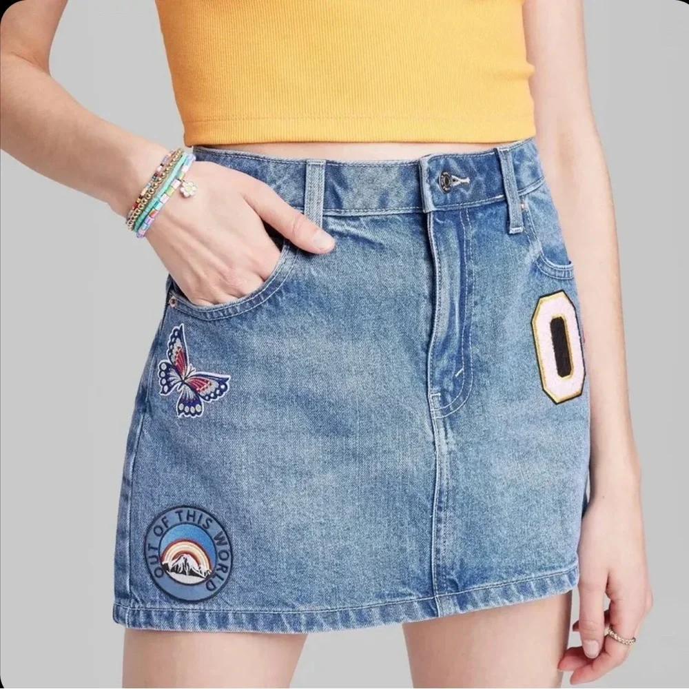 BNWT- Mini denim skirt w/ cute patches.